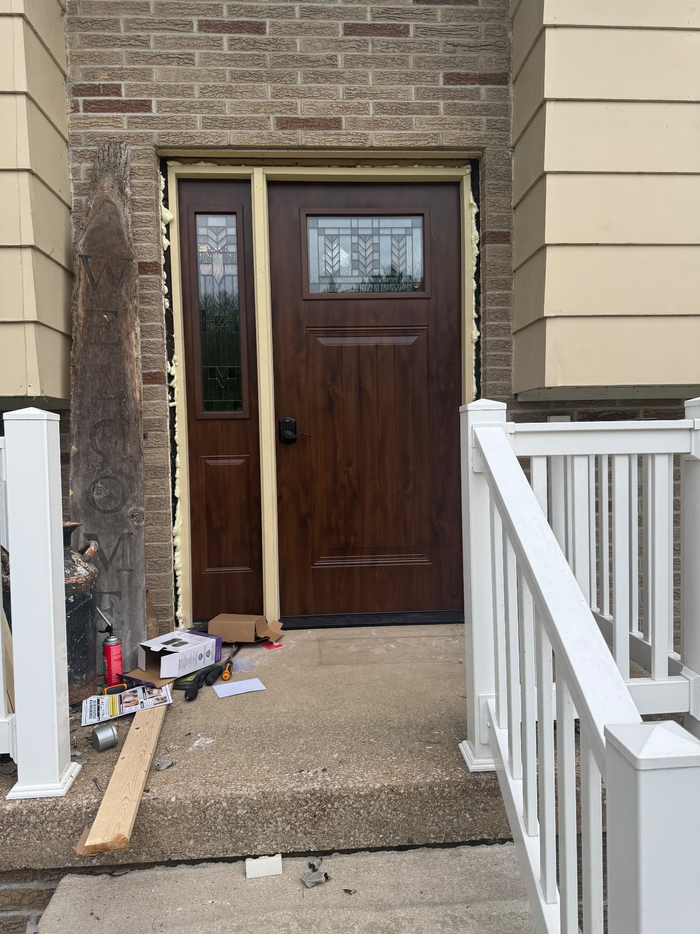 New exterior entry door installation with sidelight