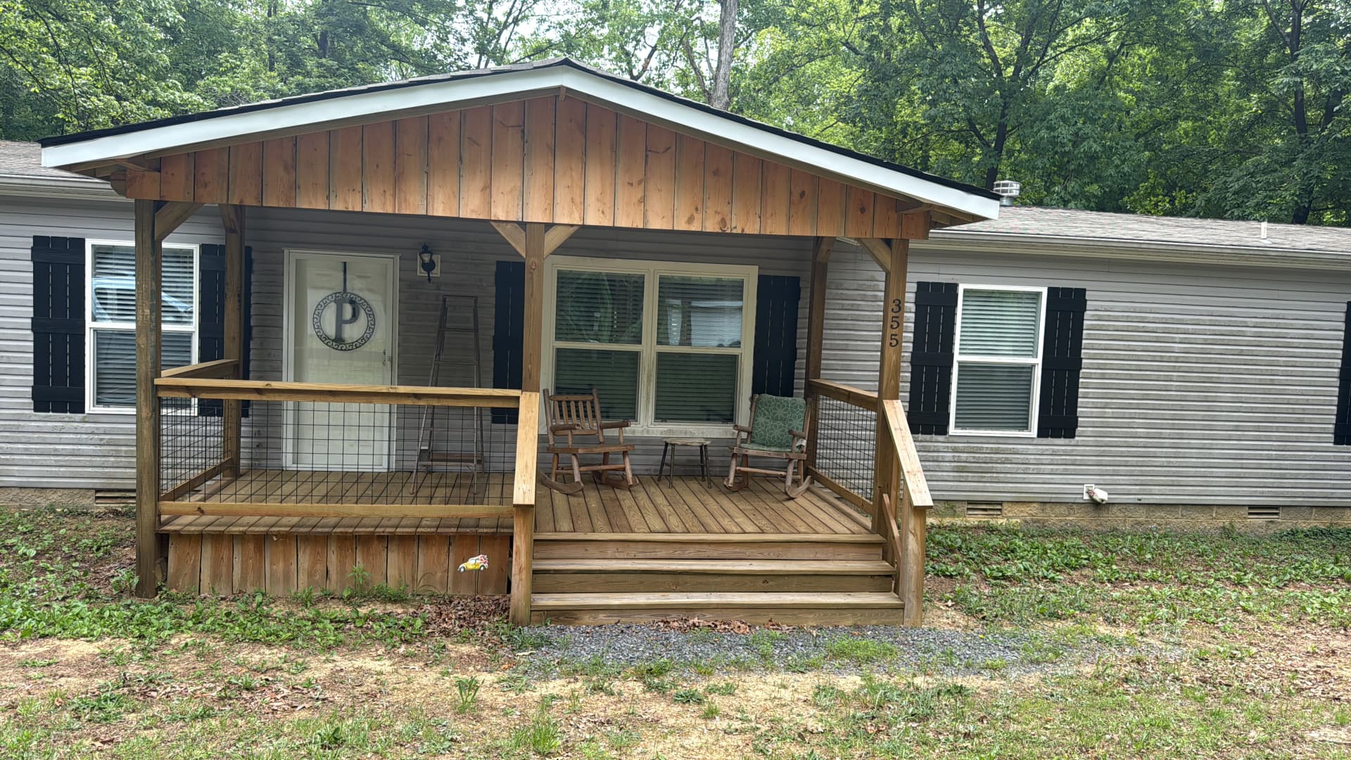 Covered wooden front porch with cedar gable built on an Ohio home