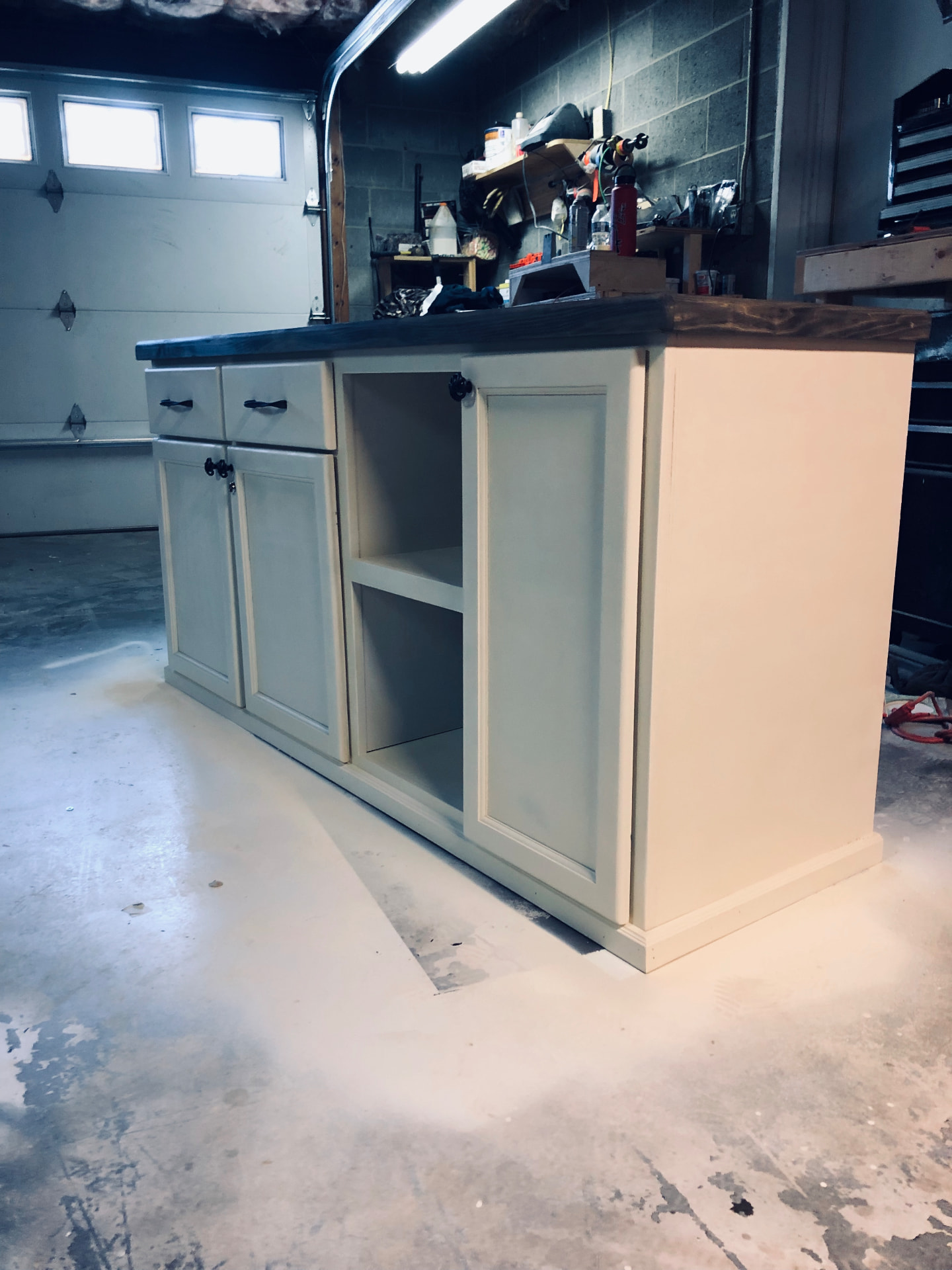 Custom kitchen island cabinet with stained wood top